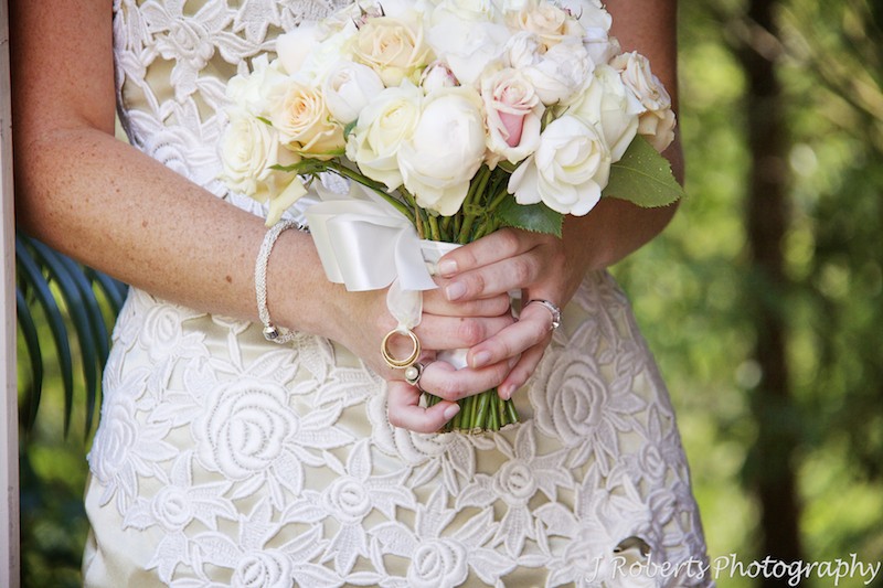 Bridal bouquet with grandparents wedding rings attached - wedding photography sydney